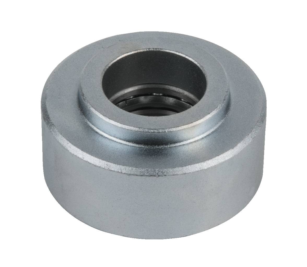 Metallic cylindrical object with a central hole, possibly a machine part or bearing, on a white background.