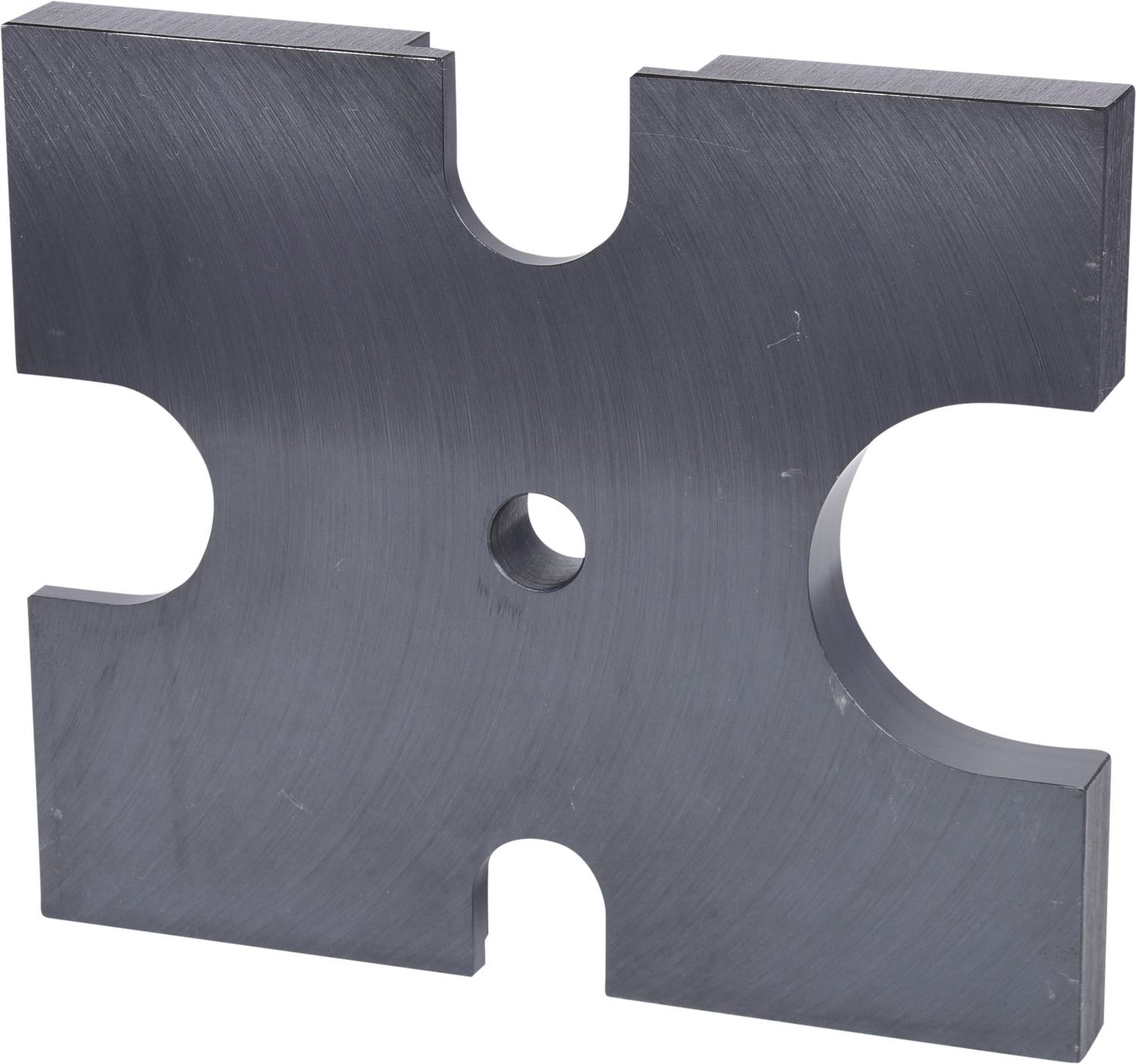 A metallic object in the shape of a cross with rounded ends and a central hole, set against a light background.