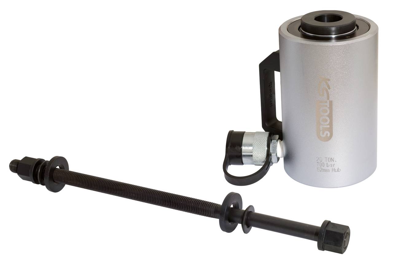 A hydraulic cylinder with an adjacent clamping tool, used for precise force transmission in industrial applications.