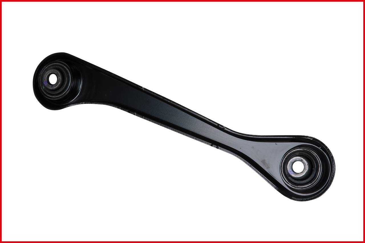 A black metal transverse control arm with two rubber bushes at its ends, against a white background, with a red frame.