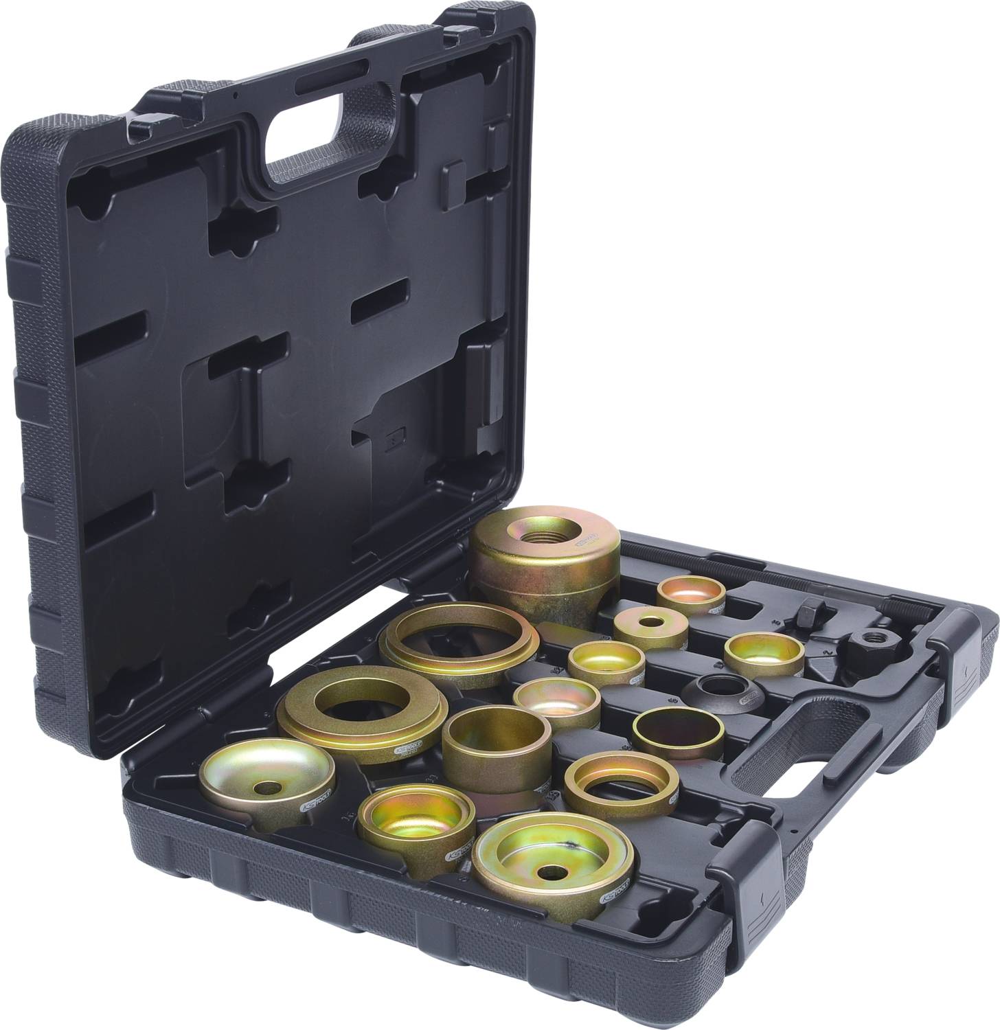 An open black suitcase containing various round metal parts of different sizes, neatly arranged.