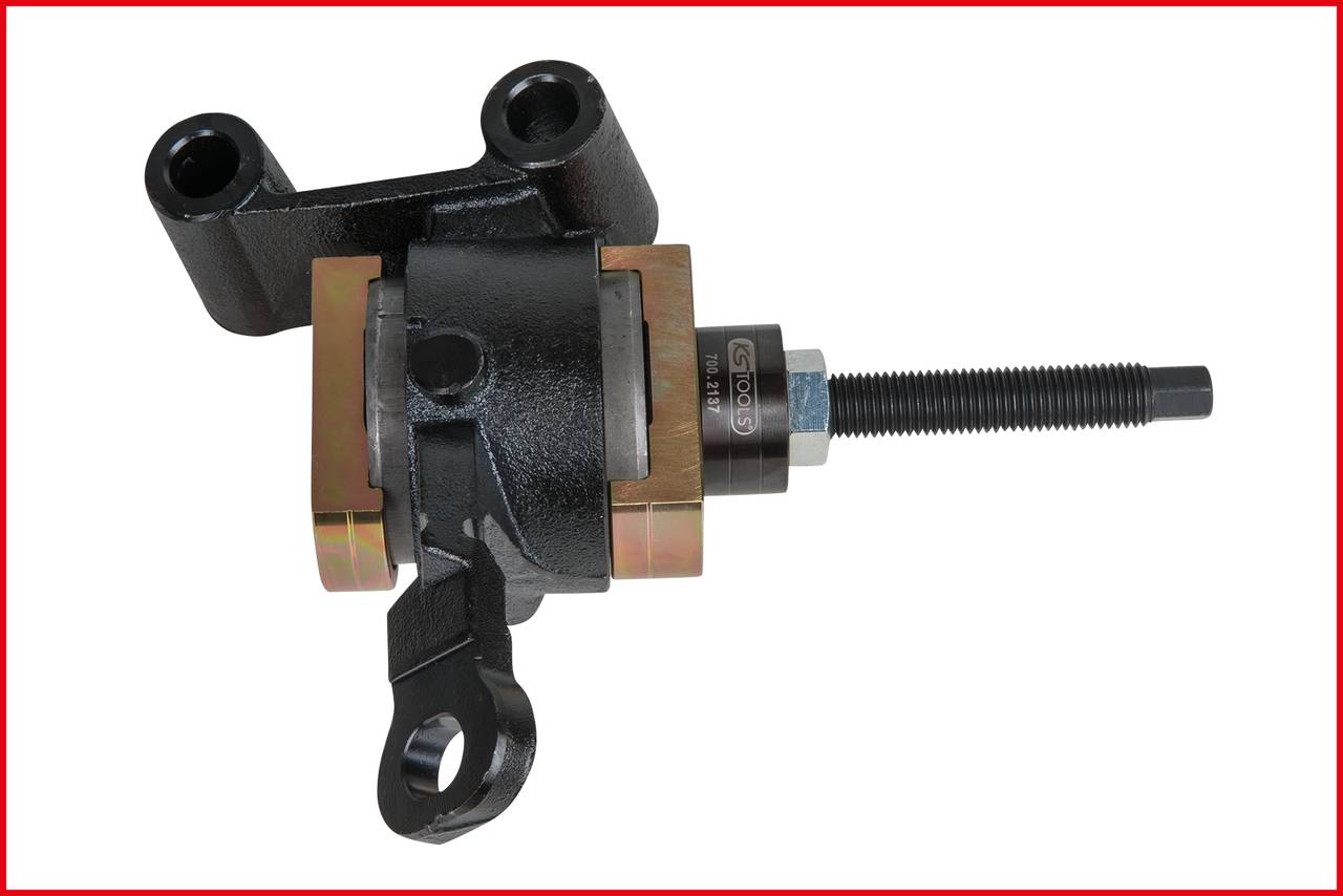 A black mechanical metal device with a long bolt and fastening elements, used for industrial applications.