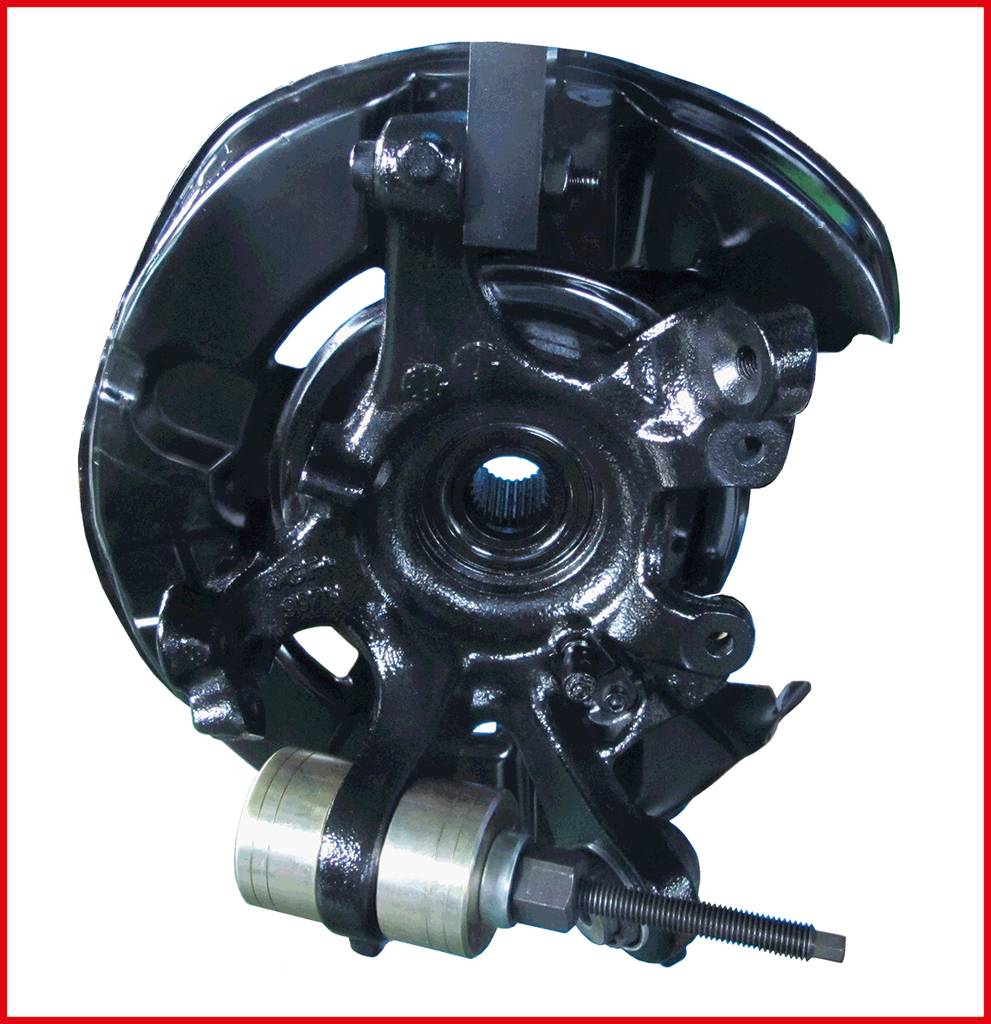 A black automotive component with mechanical parts and a bolt in the centre, possibly a wheel bearing housing.