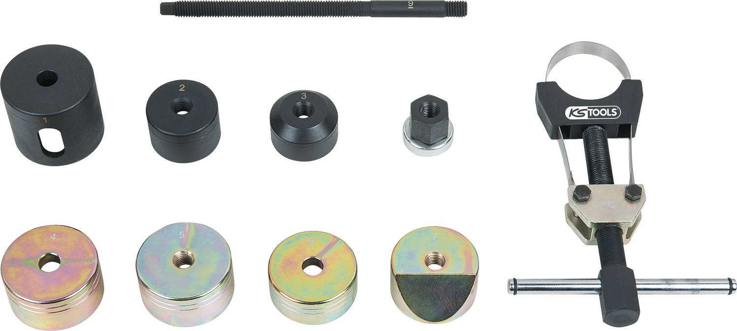 Tool set for the assembly and disassembly of wheel bearings, comprising various attachments, a spindle, and a puller.