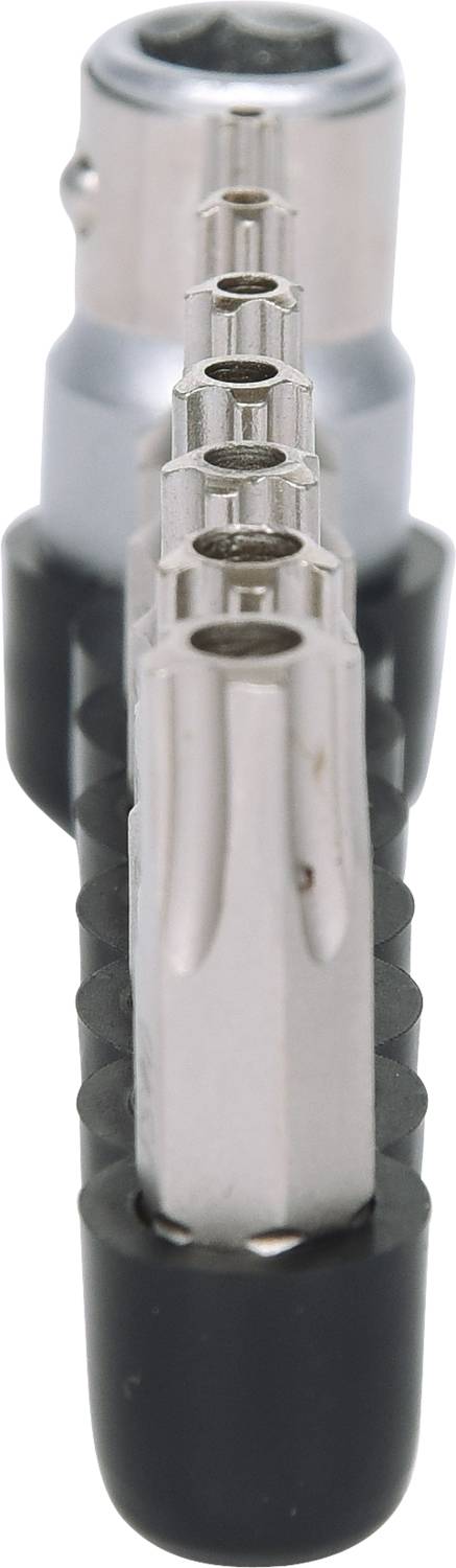 A series of screwdriver bits in a bit holder, aligned in a line; foreground shows the tips in close-up.