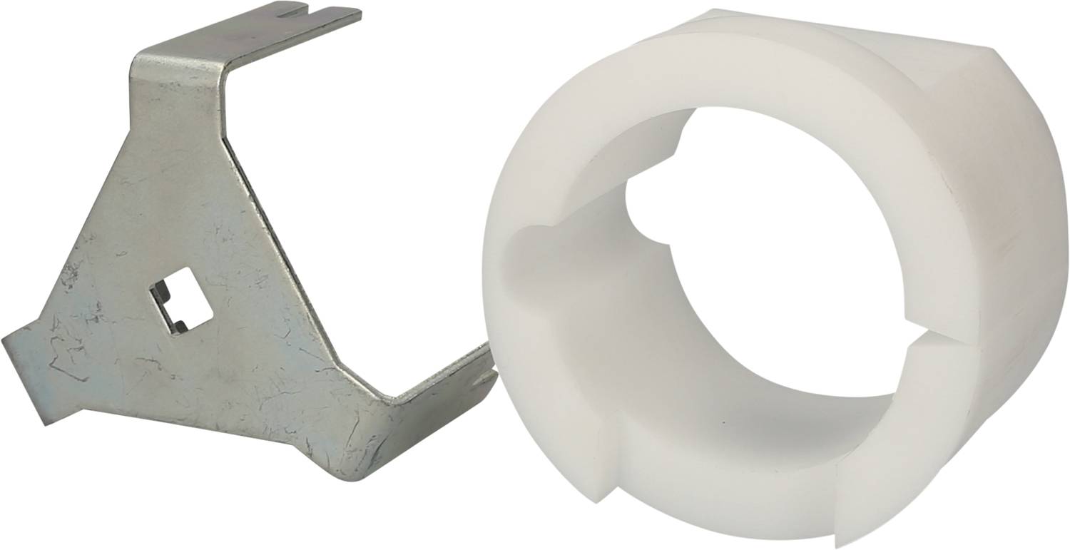A metal clip lies beside a white plastic ring, presumably parts of an assembly kit. Primarily functional in use.