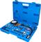 A blue tool case with a pressure gauge and various adapters and hoses, used for engine inspection.