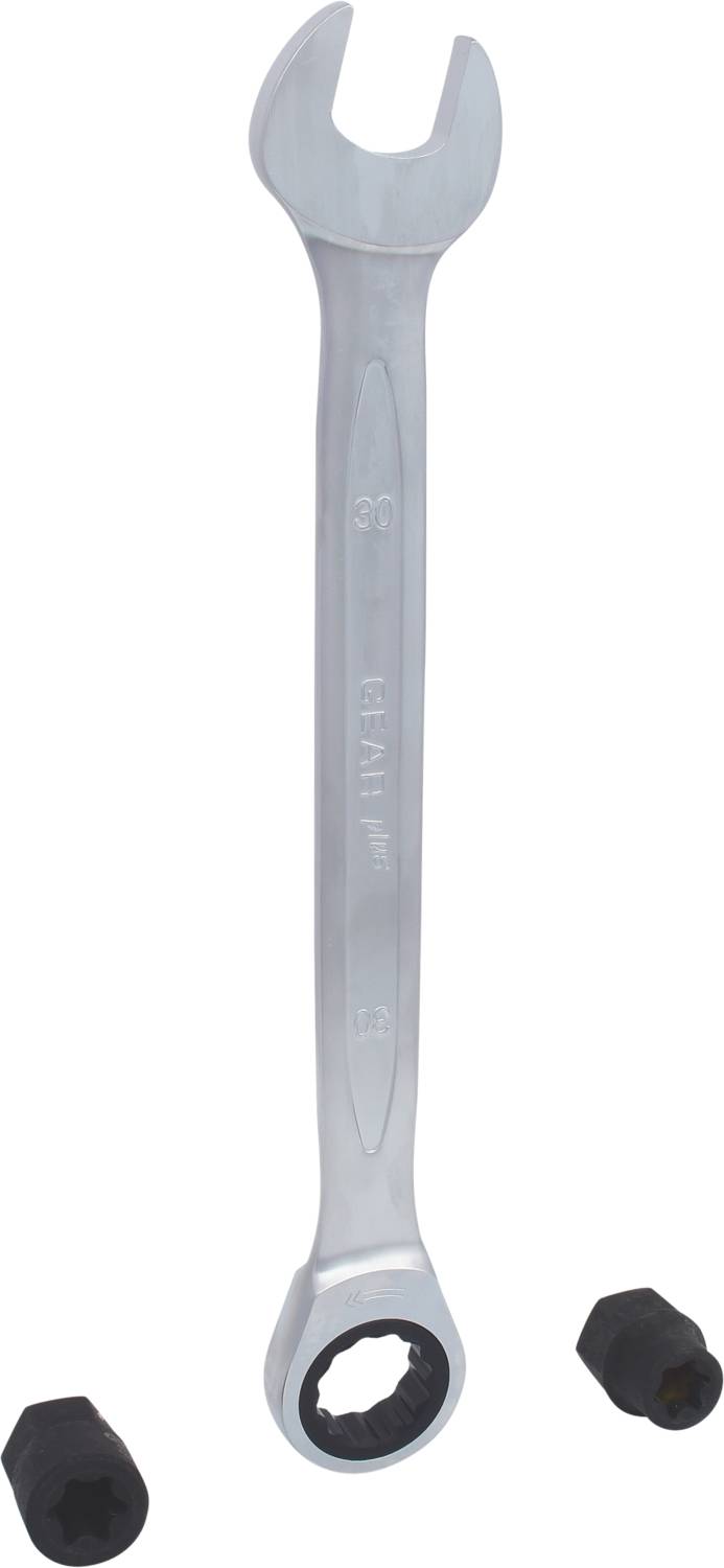 A silver spanner lies between two black screw caps.