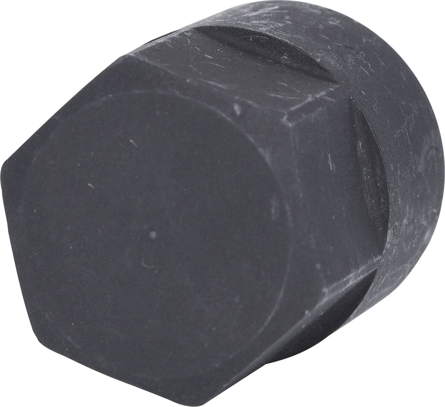 A black, hexagonal plastic lid with a rough surface, likely part of a screw cap or protective cover.