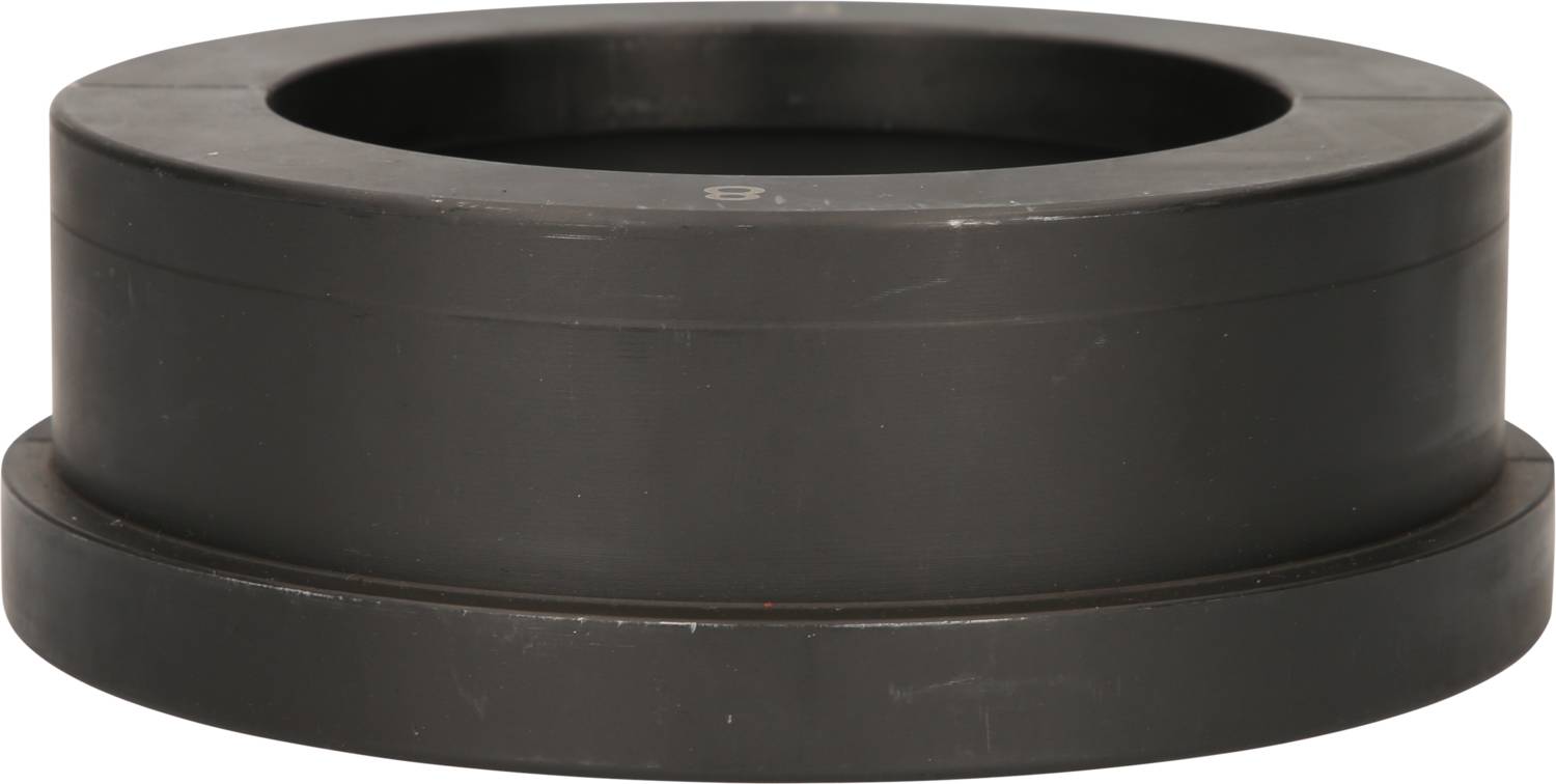 A black, cylindrical plastic component with a wide base and a depression in the centre, used for technical purposes.