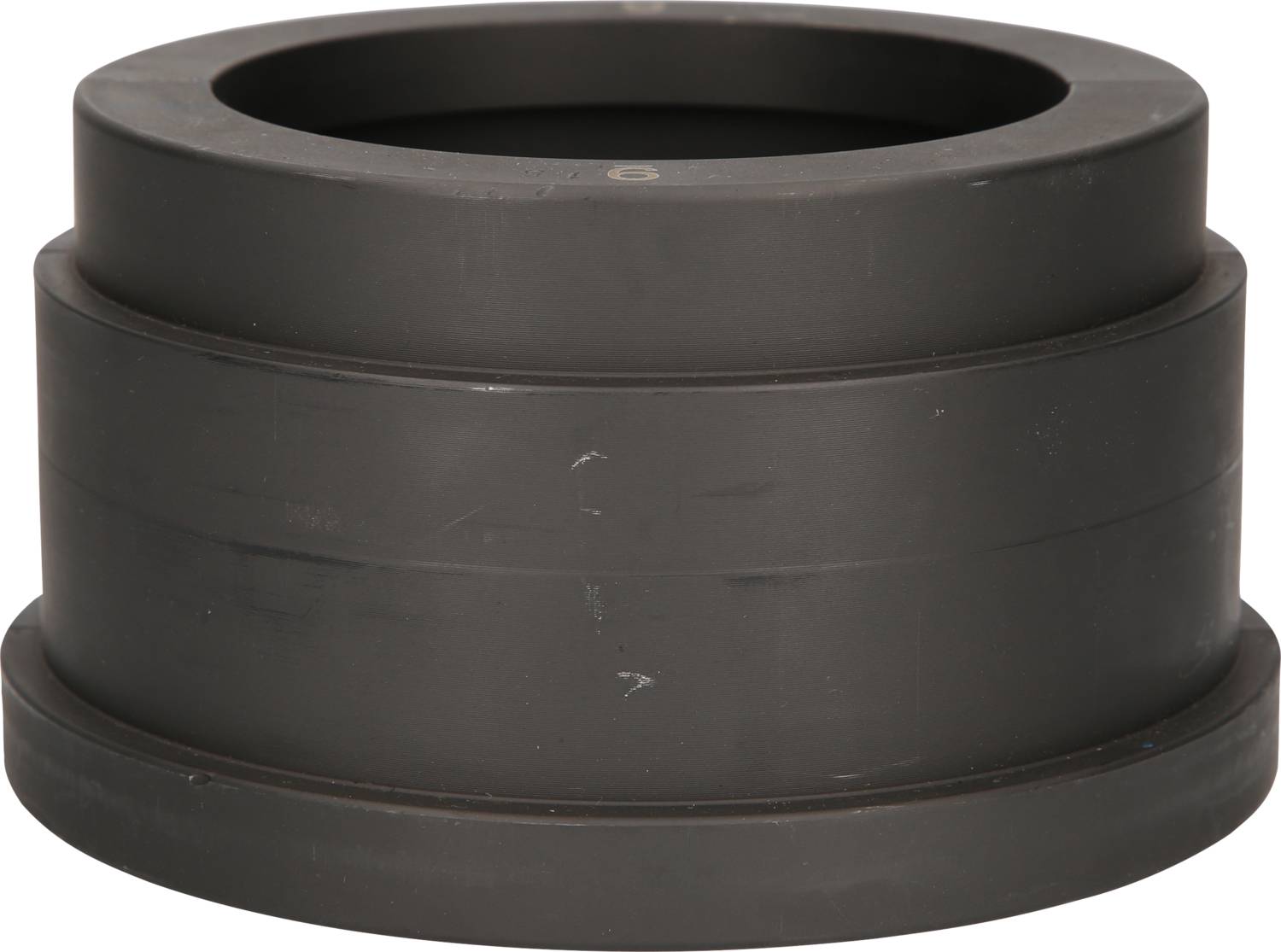 Black, cylindrical rubber joint buffer, side view, designed to reduce vibrations in machinery.
