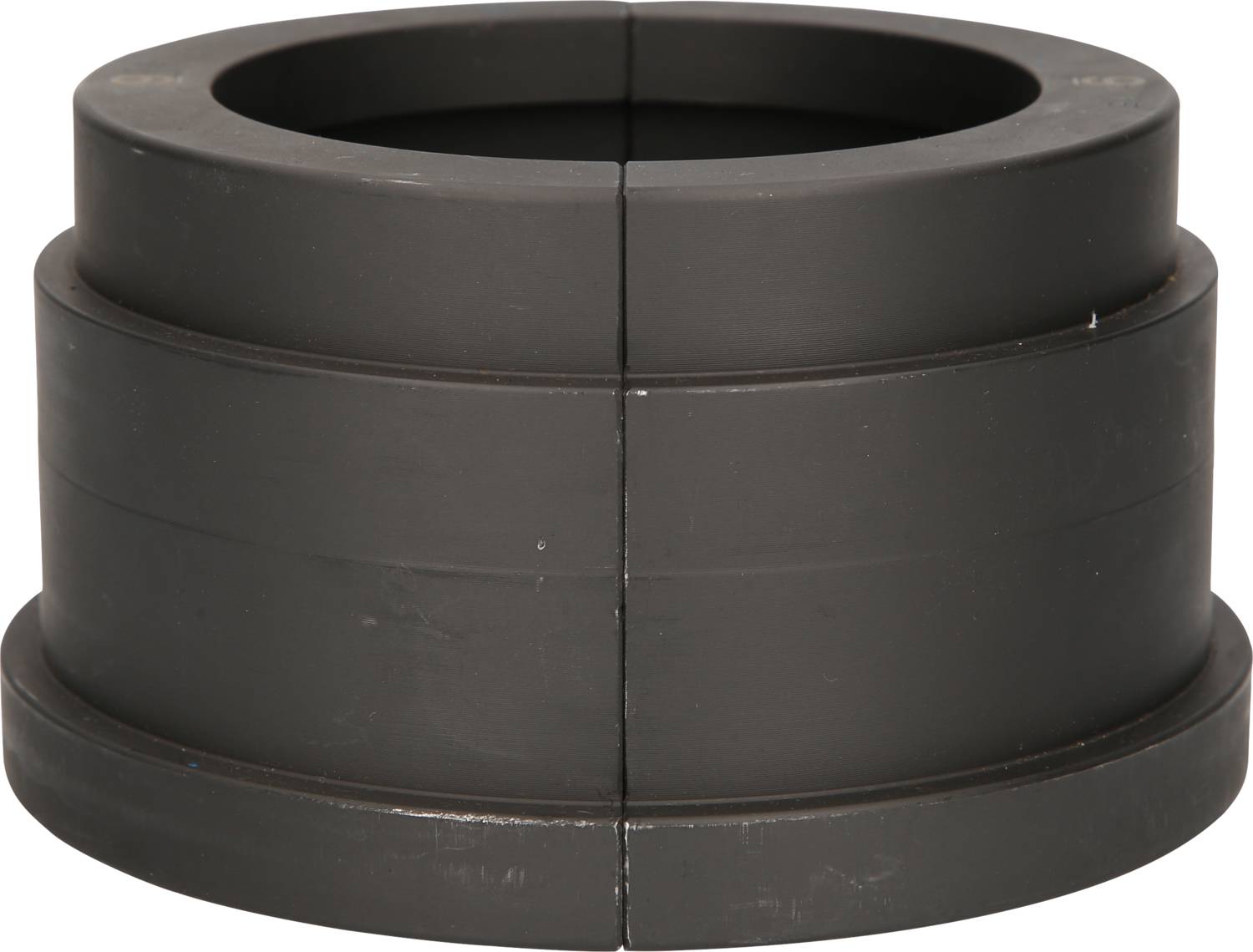 Black, cylindrical ferrite choke inductor consisting of two half-shells that, when assembled, form a round shape.