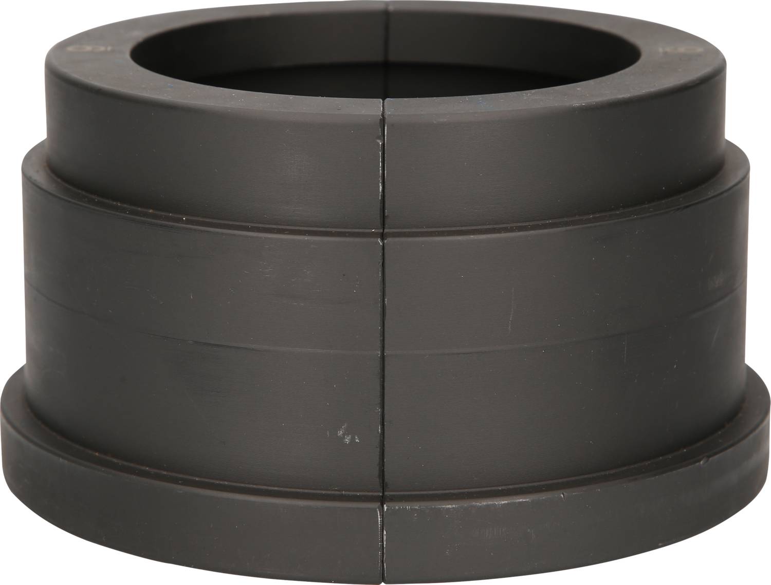 A black, cylindrical plastic adaptor with two ridged sections, likely used for connecting pipes or similar objects.