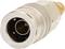 Metallic adaptor plug with a ridged grip and circular opening, suitable for electrical or technical connections.
