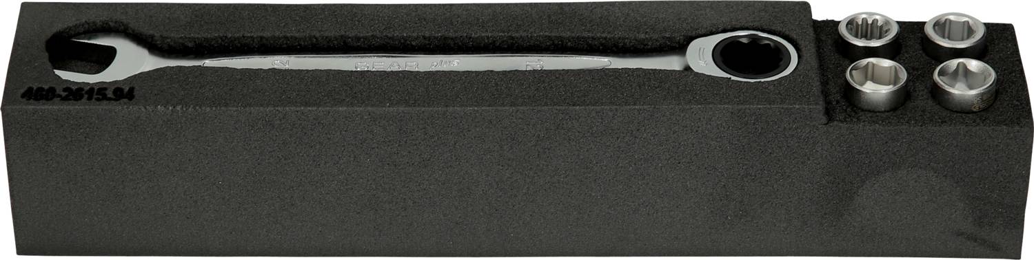 A ratchet spanner set in a black foam packaging. Contains one large spanner and four different socket sizes.