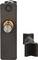 A black, rectangular metal door lock with a round, silver handle and golden details. It is resting on a white surface.