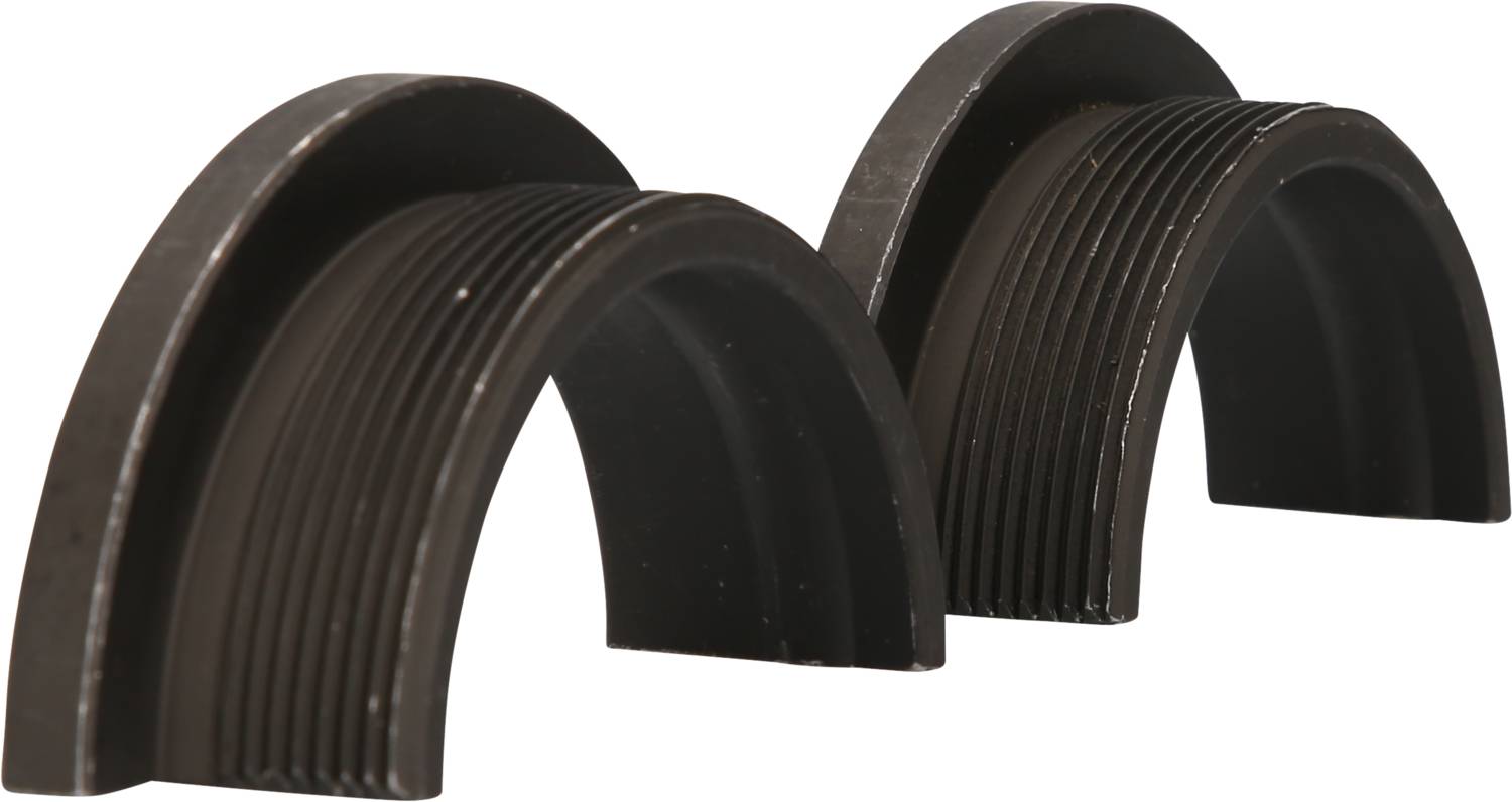 Two black, curved plastic pieces side by side, shaped like half cylinders. They are smooth with grooves on the outside.