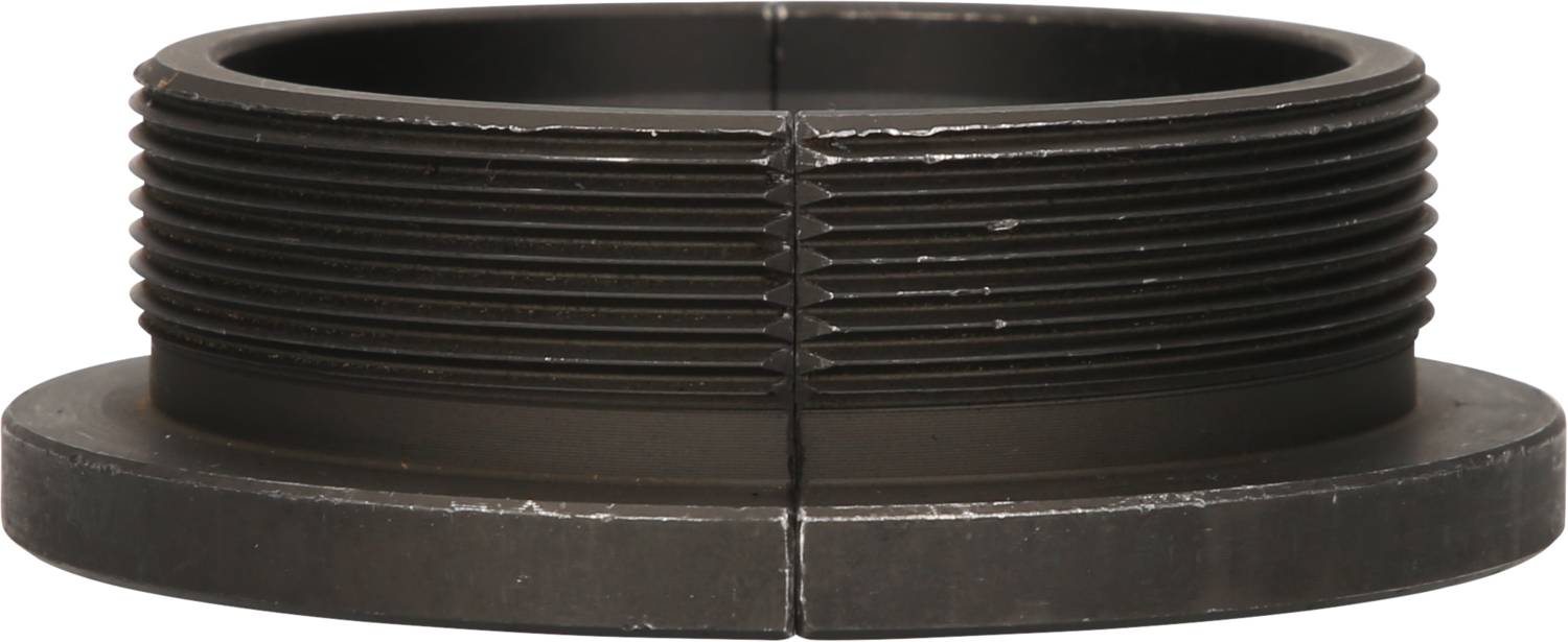 A black, ribbed metal ring or adapter, lying horizontally, shows fine details of its ribbed structure.