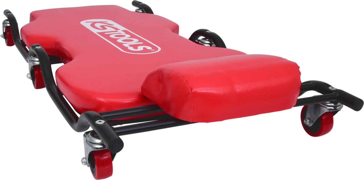 Red workshop trolley bed with cushion, four wheels and the 'KS TOOLS' logo. Ideal for working underneath vehicles.
