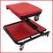 Red, padded workshop seat with adjustable seat height and castors for easy mobility in the garage or workshop.
