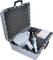 A grey tool case contains a power screwdriver with attachments and accessories, nestled in foam padding.