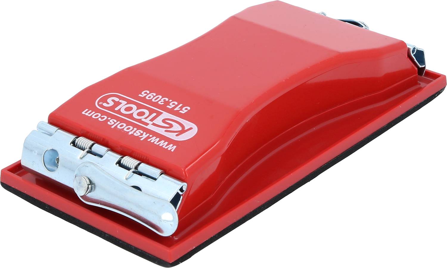 Red hand-held sanding tool with a black base and silver metal clips, lying on a smooth surface.