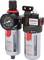 Pressure regulator with two cylindrical containers, pressure gauge, red and black control elements. Wall-mounting bracket.