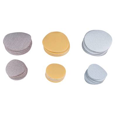 Six stacks of round grinding discs in grey, brown, and yellow. Each stack contains multiple discs that vary in colour.