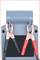 A grey device with two clamps: on the left a black negative terminal, on the right a red positive terminal. They are holding cables.