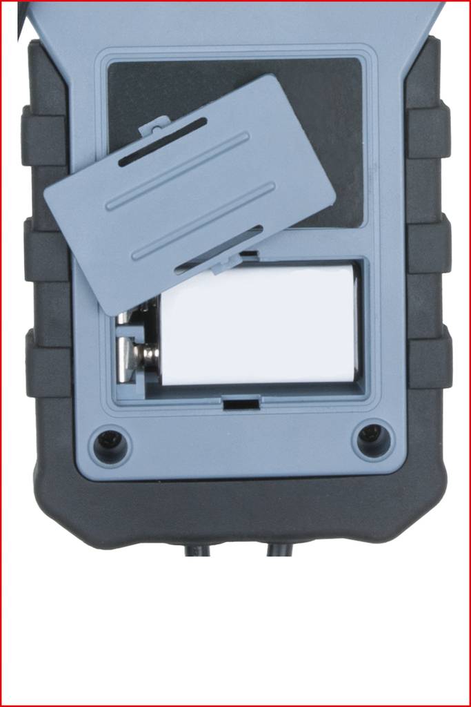 An open battery compartment of an electronic device with a removed battery cover, revealing two axle screws.