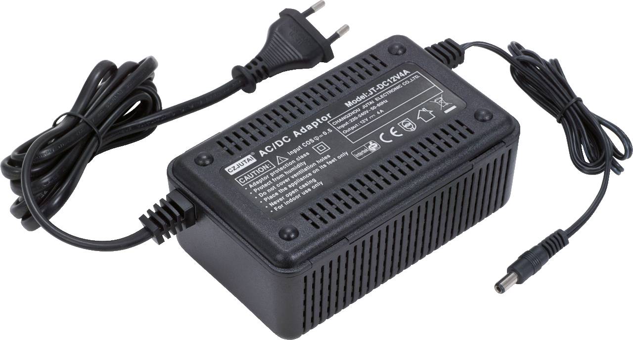 Black power supply with detachable power cable, marked 'AC/DC Adapter', technical details and safety instructions printed on the surface.