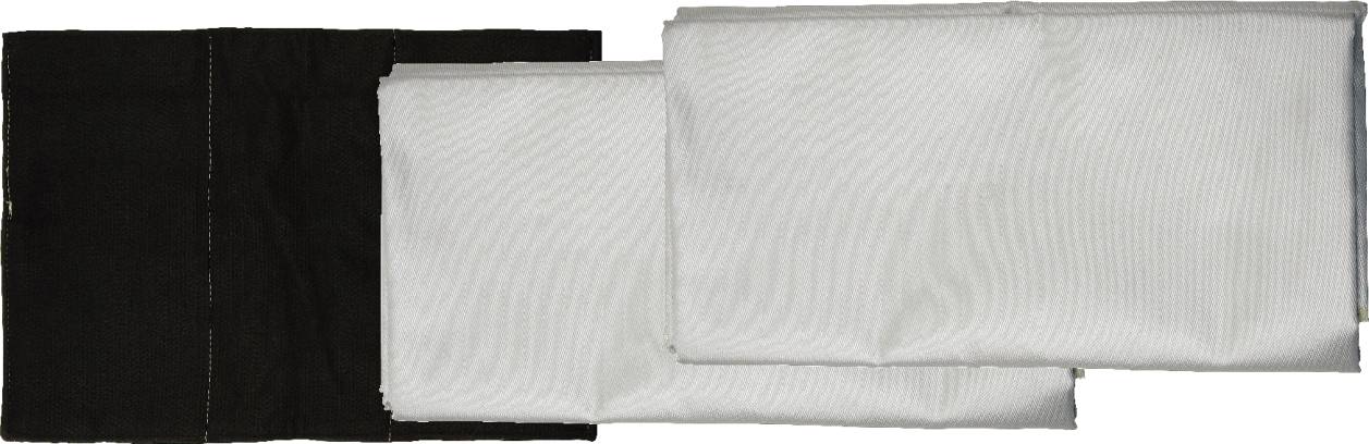 Two white fabric pieces folded on top of each other lie beside a black, folded piece.