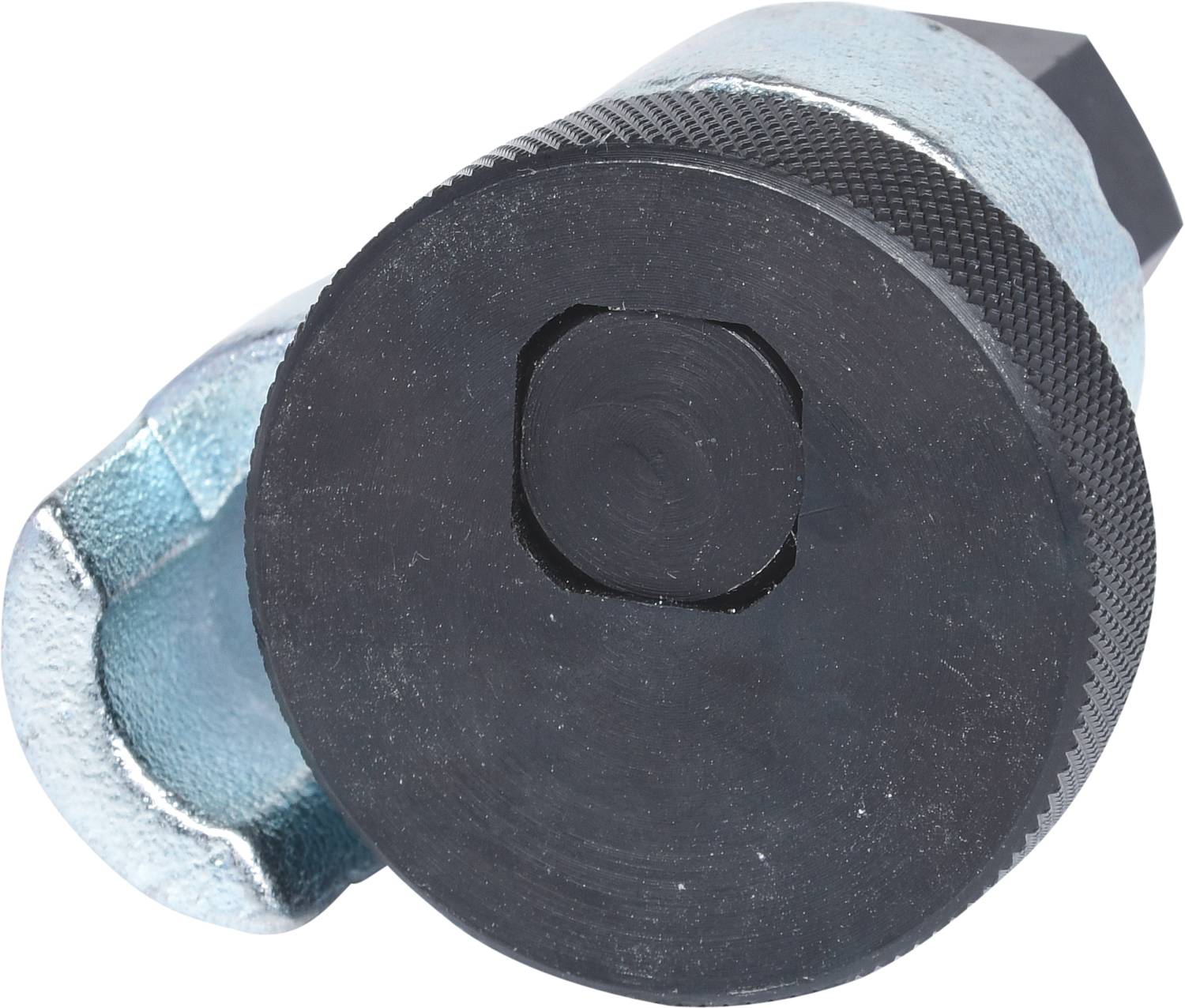 A silver metal oil sump spanner with a round black handle. Used for removing oil sump drain plugs.