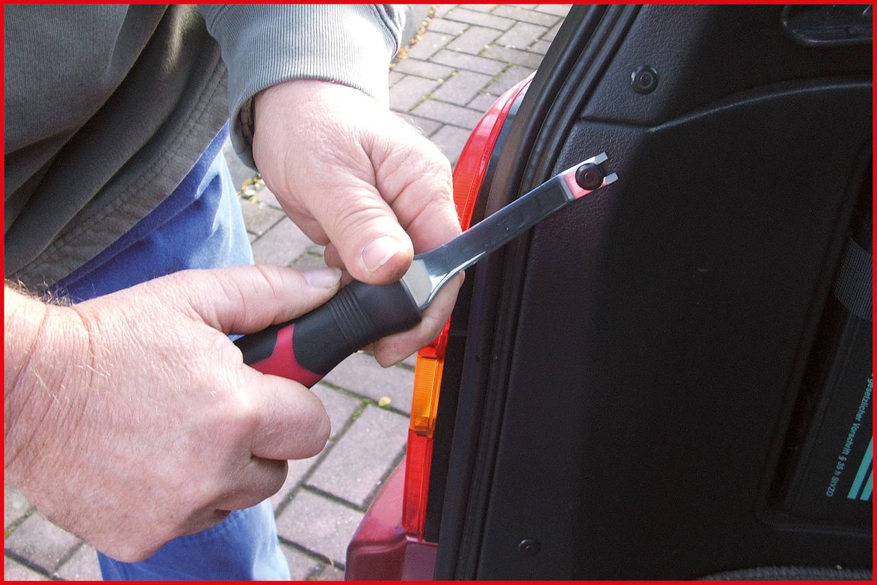 A person is using a tool to remove a car part. A close-up shows hands and a screwdriver, along with a car component.