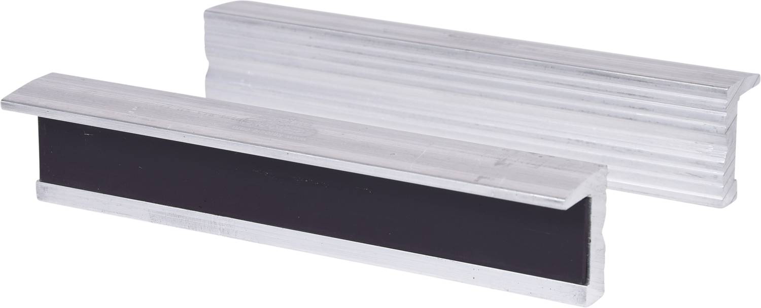 Two rectangular metal parts made of aluminium, one with a black rubber insert, are lying on top of each other, presumably parts of a machine tool.