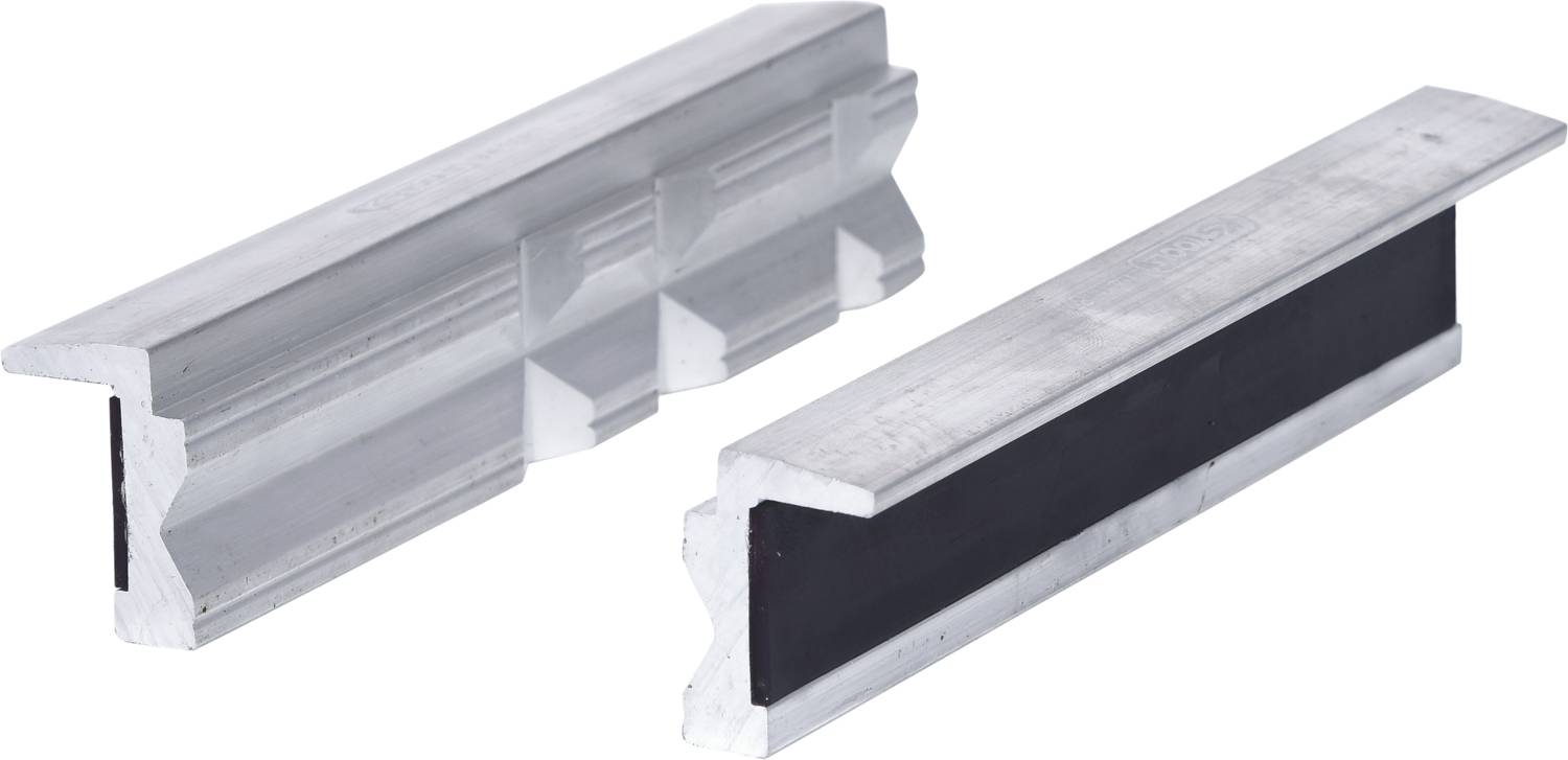 Two silver metal U-shaped profiles, one with a smooth surface, the other with a corrugated structure, lie side by side.