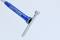 A blue hose connected with a metal valve tool. The hose has the inscription 'BRILLIANT' in white.