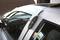 An air wedge is inserted between the door and frame of a car to carefully open the door without causing damage.