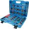 A blue toolbox with various metal parts and tools, including discs, spanners, and pliers, for car repair.