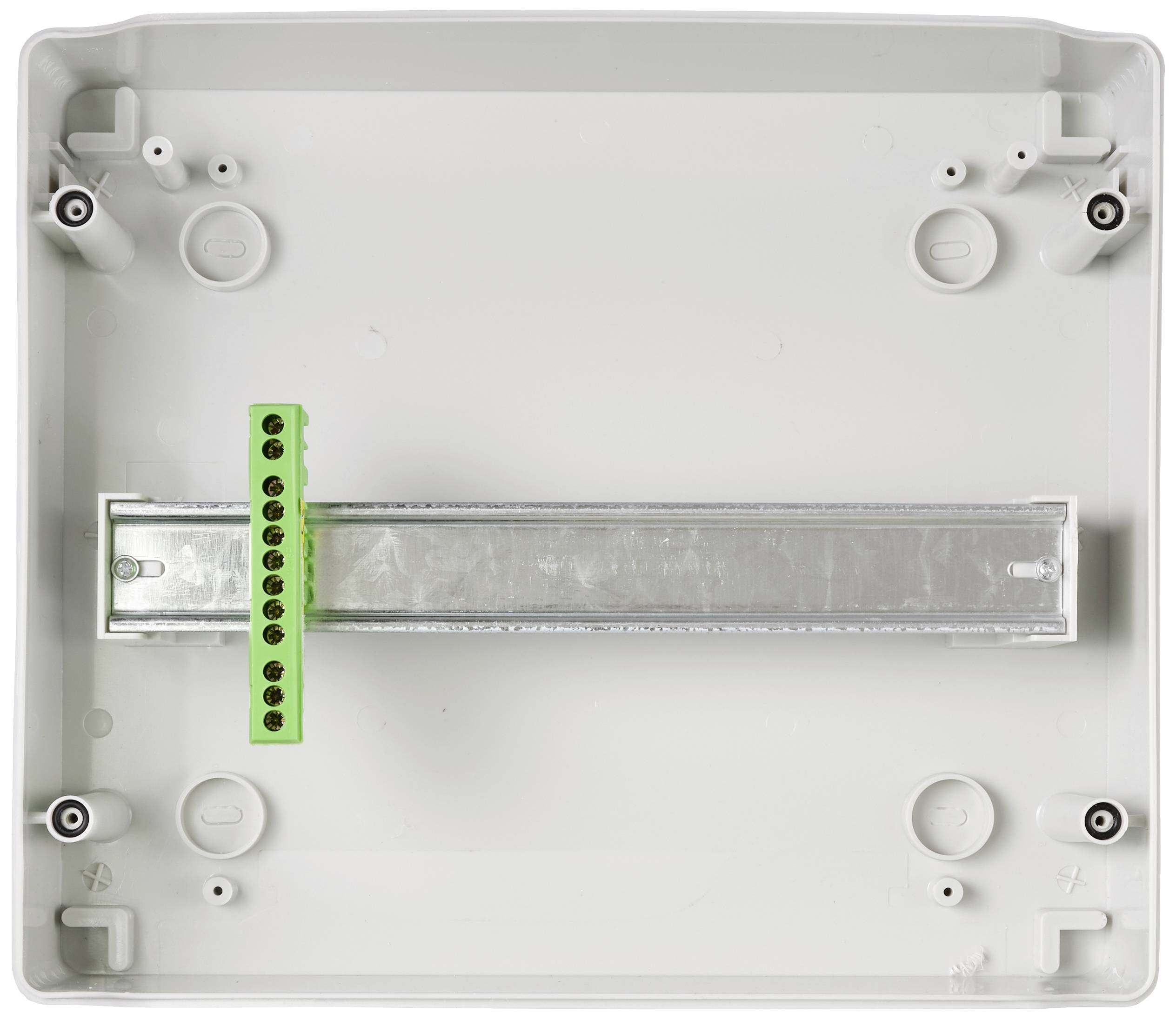 Empty plastic housing with integrated mounting rail system and green terminal block. Suitable for electrical installations.