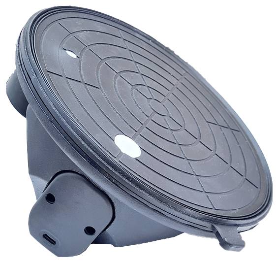 A black drain cover with round, concentric patterns in the centre; side clips for fixing visible.