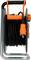 An extension lead in a metal frame with a multi-socket power strip and orange details, coiled for easy use.