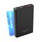 Black portable charger with LED display showing 73%, next to a blue credit card. Ansmann product, lightweight and compact.