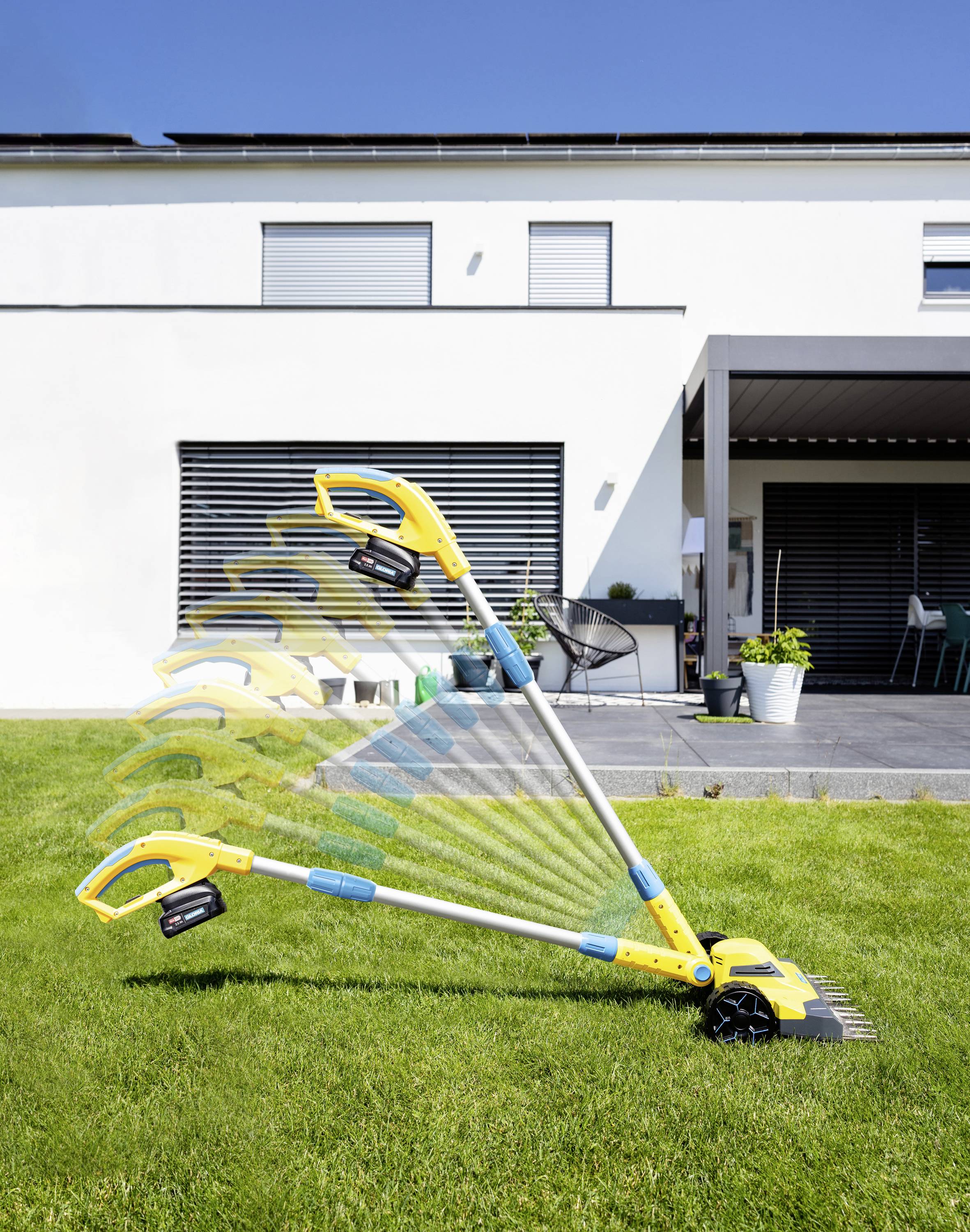 A yellow lawn trimmer with an adjustable handle demonstrates various positioning settings on a lawn in front of a modern house.