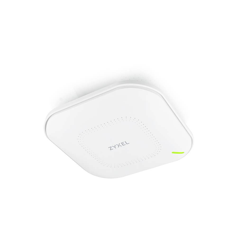 A white, square Zyxel WLAN access point with rounded corners mounted on the ceiling, displaying a green status light.