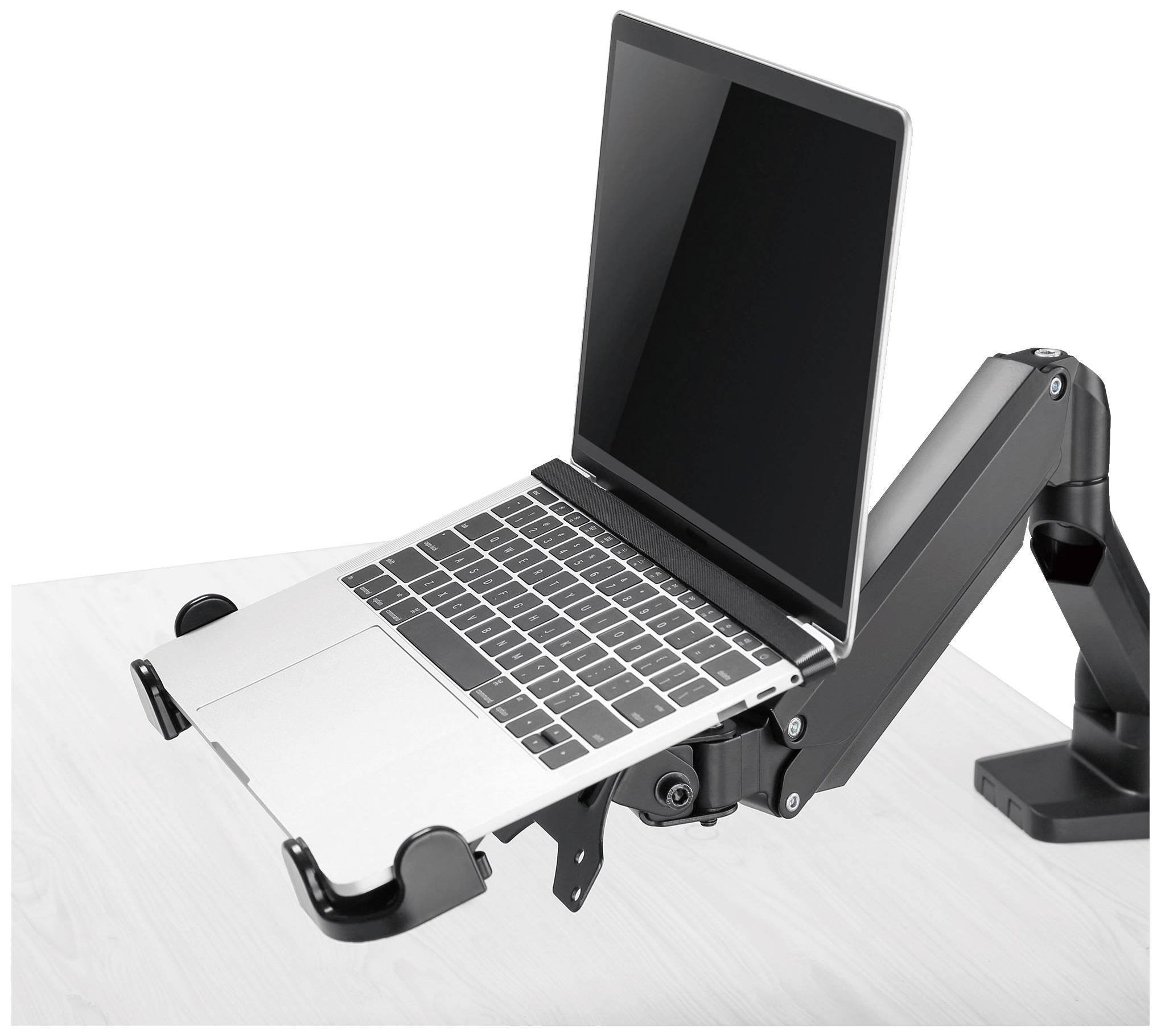 A laptop is positioned on an adjustable desk arm mount attached to a table. The screen is slightly tilted.