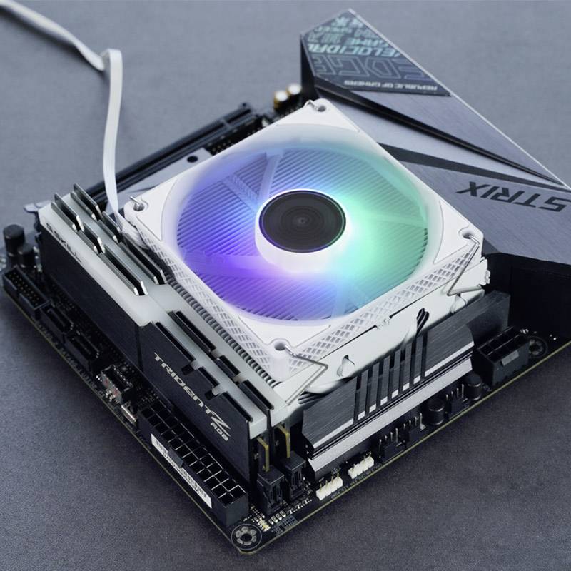 A computer motherboard with a built-in illuminated fan, showcasing cooling technology with RGB lighting.