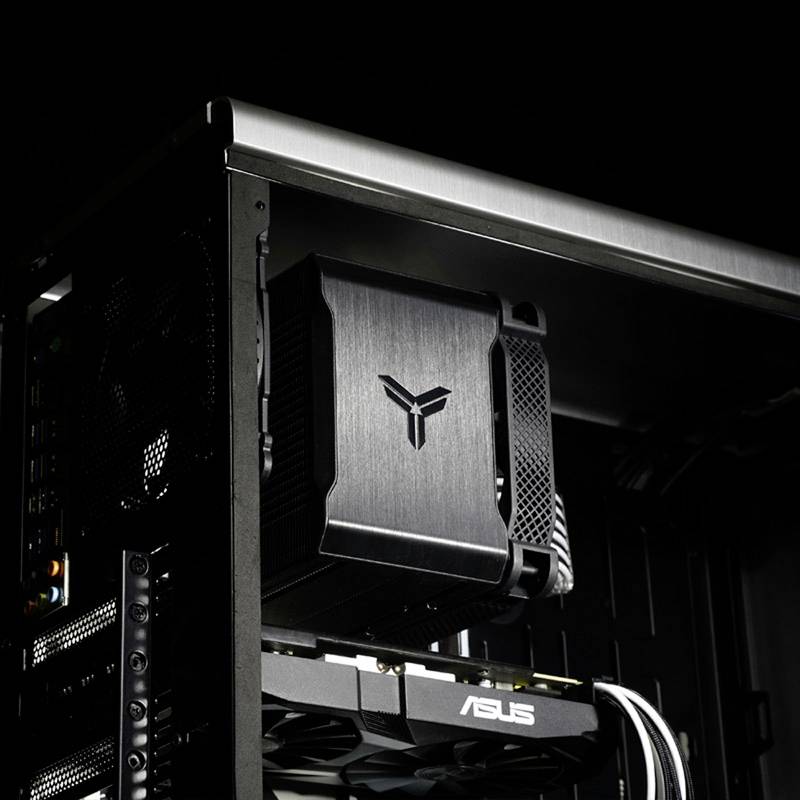 A computer case with visible fans and ASUS components in a PC. The case has a distinctive, black design.