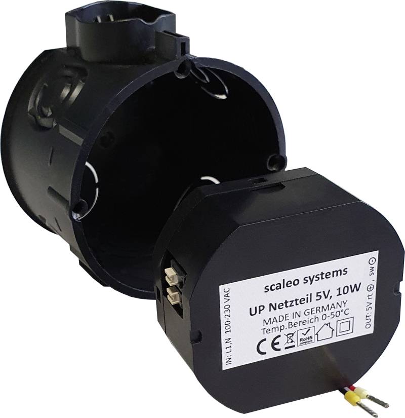 Cylindrical UP power supply from Scaleo Systems with 5V, 10W output. Label shows 'Made in Germany', temperature range 0-50°C.