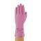 A hand is wearing a pink latex glove with safety markings.